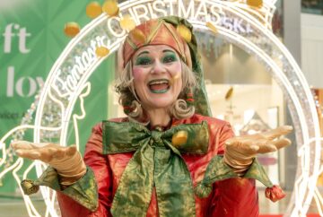 Elf and golden coins in shopping centre in Glasgow