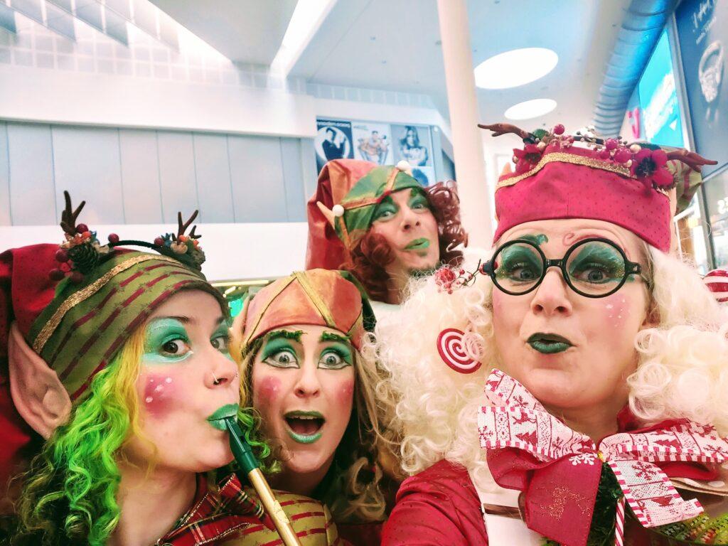 Playful group of mischievous elves posing for a selfie, radiating pure joy and character. Their mischievous faces and contagious sense of fun bring a delightful charm to the image.